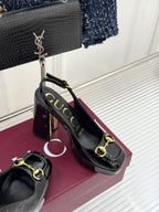 Gucci black patent heeled shoes with gold horsebit trim and chunky glossy heel