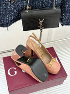 Light pink slingback pumps with chunky heel and gold horsebit buckle, side angle