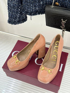 Gucci patent leather pumps in peach with gold horsebit trim and block heel