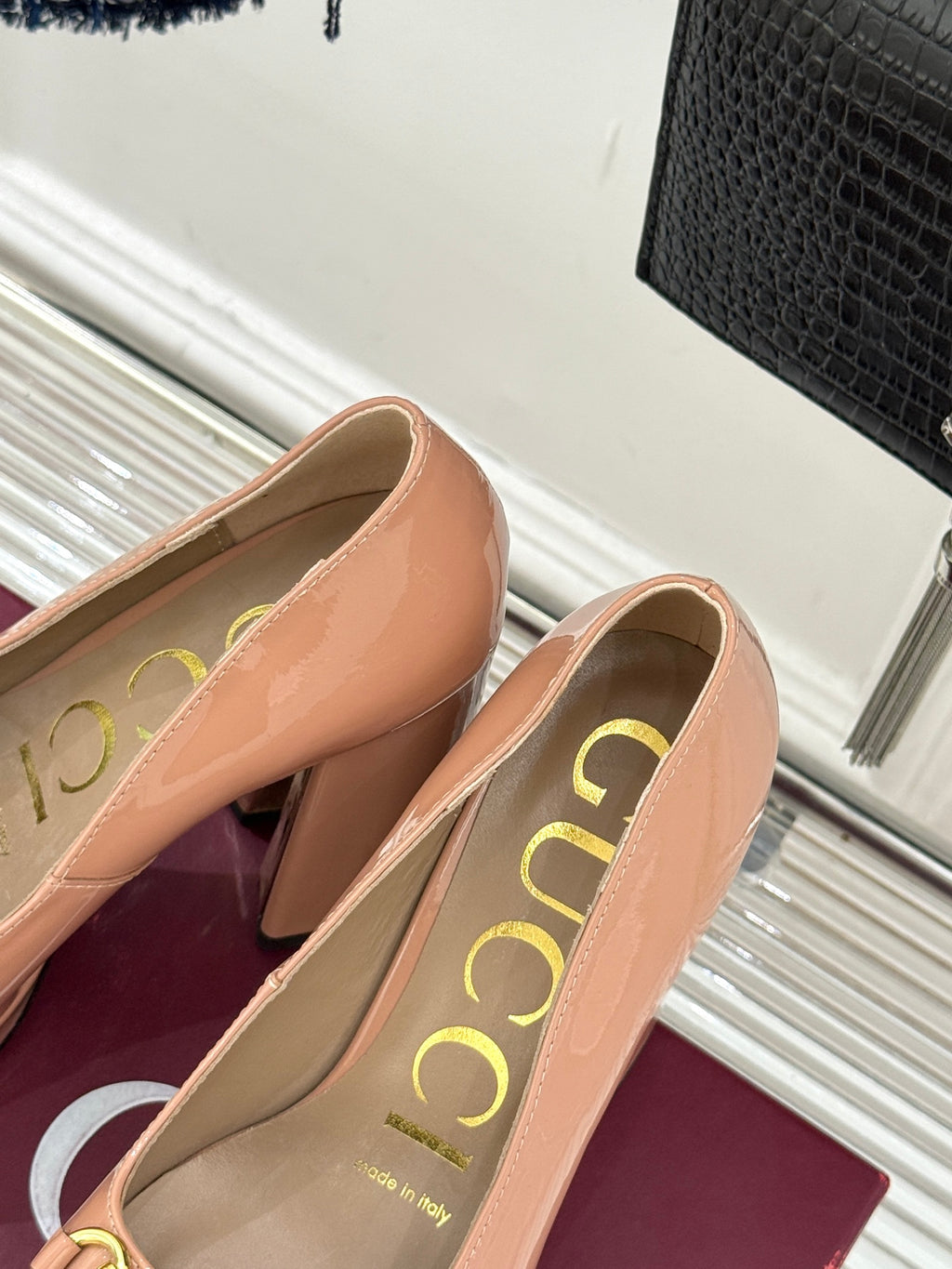 Gucci peach patent leather pumps with gold horsebit trim and curved toe