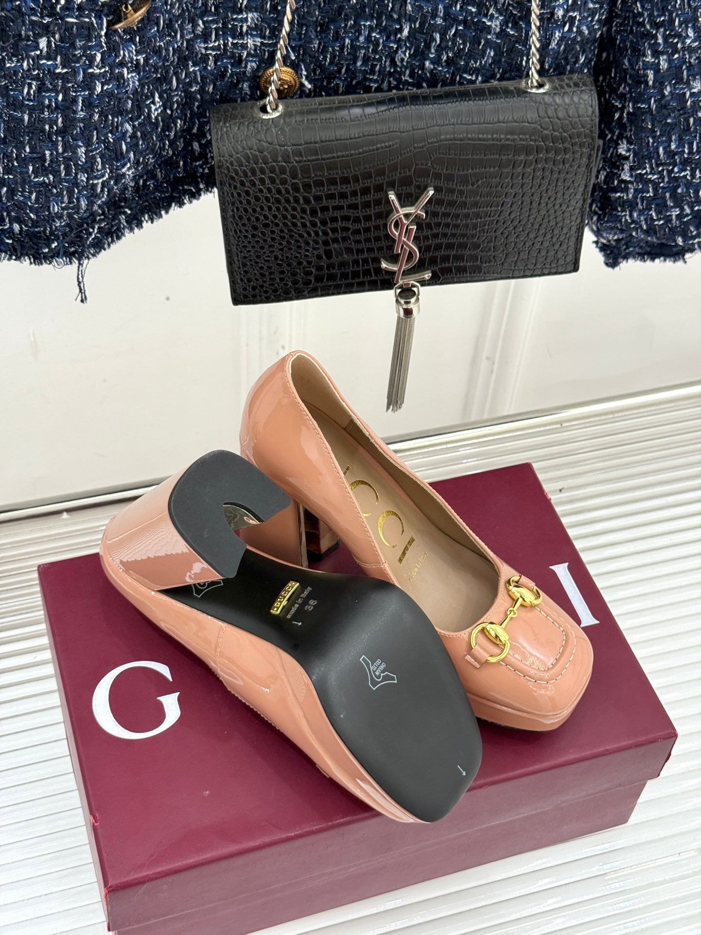 Gucci peach patent leather pumps with gold horsebit detail; view of interior sole