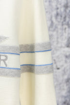 Cream long clothing fabric with blue horizontal stripes and stitched hem