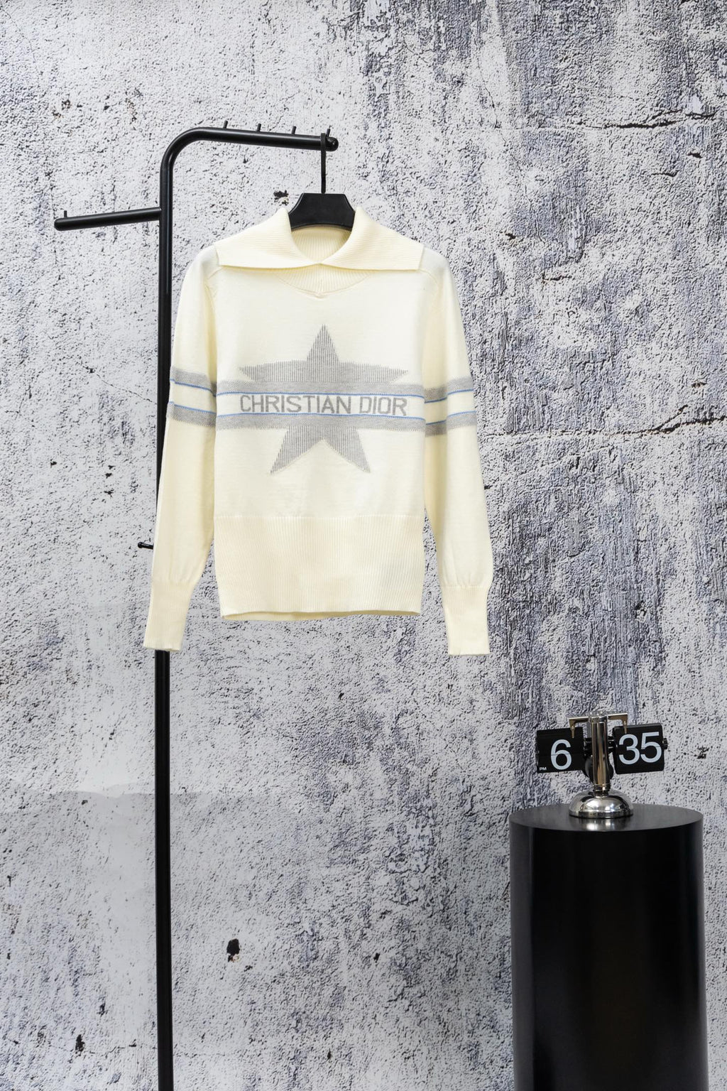 Cream long-sleeve sweater with high neck, blue stripe trim, and Christian Dior logo print