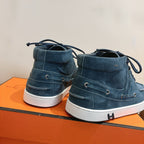 Unisex blue suede lace-up shoes heel view with white soles and rear stitching