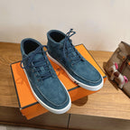 Unisex blue suede lace-up shoes with white soles and padded collars