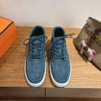 Unisex blue suede lace-up shoes with white rubber soles and eyelet laces