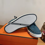Unisex blue suede shoes outsole view with white tread sole and dark trim