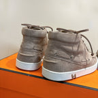 Hermes unisex gray suede high-top sneakers, heel view with lace-up and white sole.