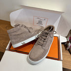 Hermes unisex gray suede high-top sneakers with lace-up, eyelets and white sole detail.