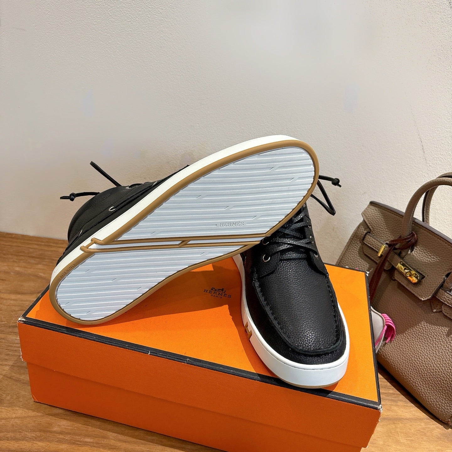 Hermes black lace-up sneakers outsole view with textured white tread