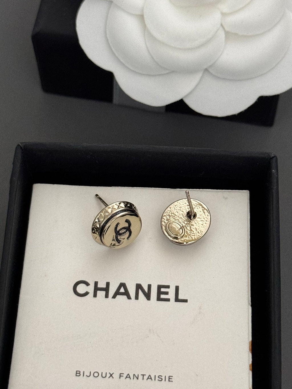Gold-tone Chanel CC stud earrings with black enamel, round disc design