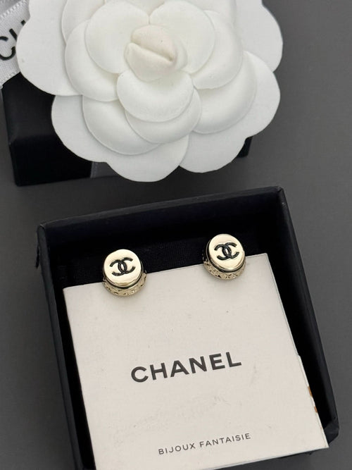Gold-tone Chanel CC stud earrings, round bezel with black logo detail