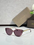 Burgundy oversized round sunglasses with purple lenses and gold-tone hinges