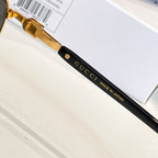 Gucci glasses close-up: black temple with gold lettering and “MADE IN JAPAN”
