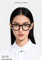 Black eyeglasses on a model with white button-up shirt