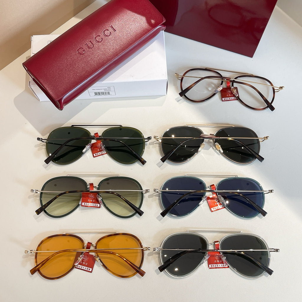 Assorted Gucci round sunglasses with mixed frames and colored lenses.