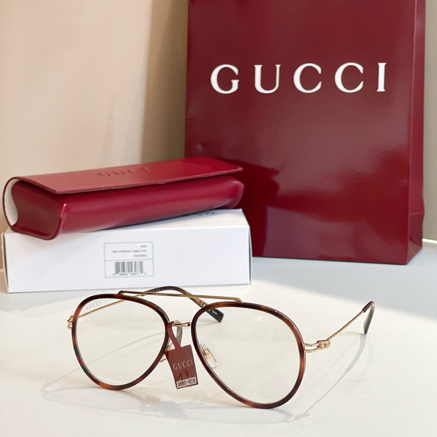 Gucci round sunglasses with light green lenses and brown tortoiseshell frame.