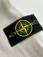 Stone Island logo patch on light gray knit sweater fabric