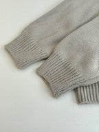 Light gray knit sweater cuffs with ribbed cuffs and textured knit weave
