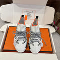 Hermes unisex sneakers, white knit with gray laces, orange trim, checkered side panels