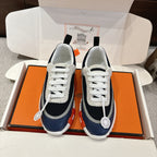 Unisex low-top sneakers in navy and white with white laces and chunky sole