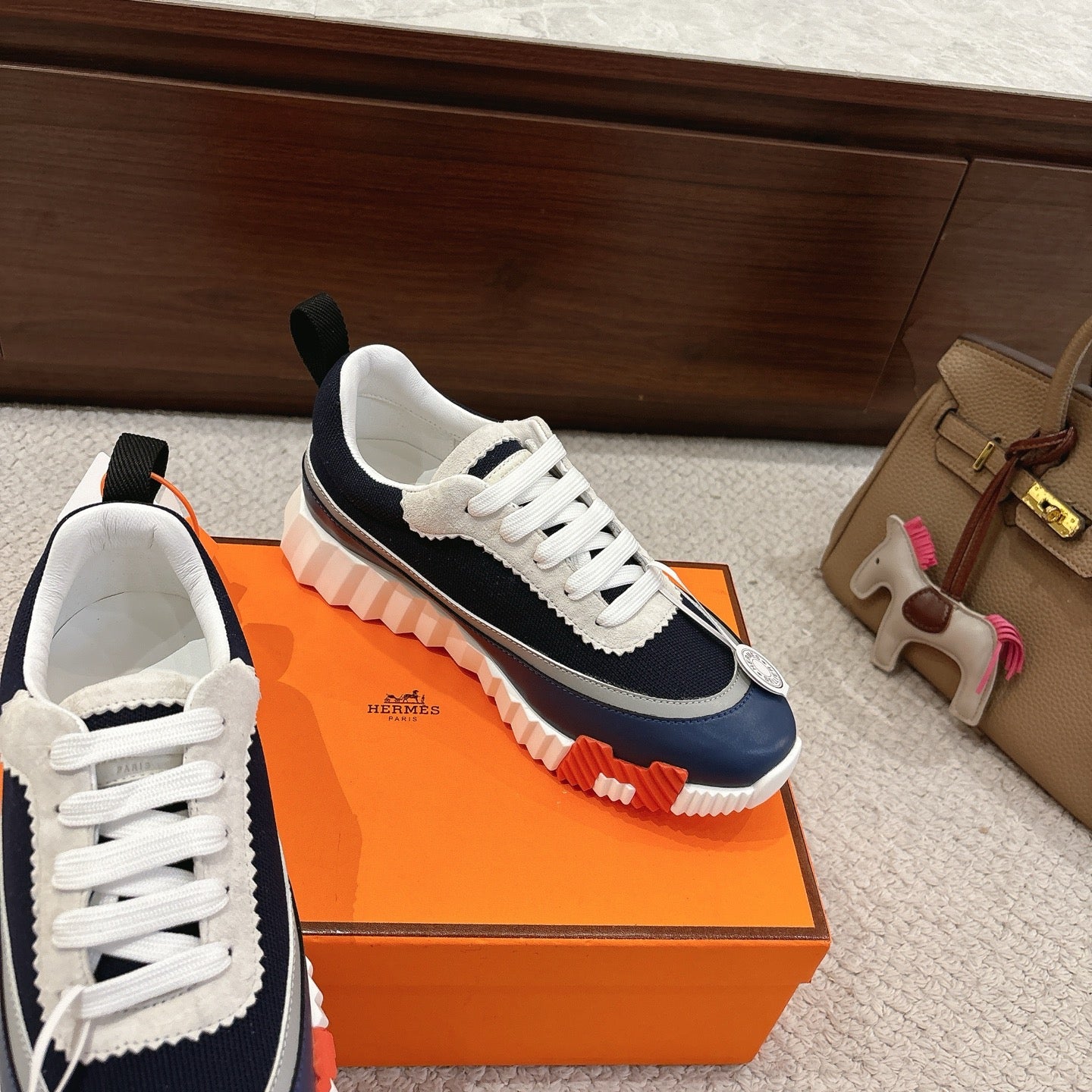 Unisex sneakers in navy and white with white laces and chunky rubber sole
