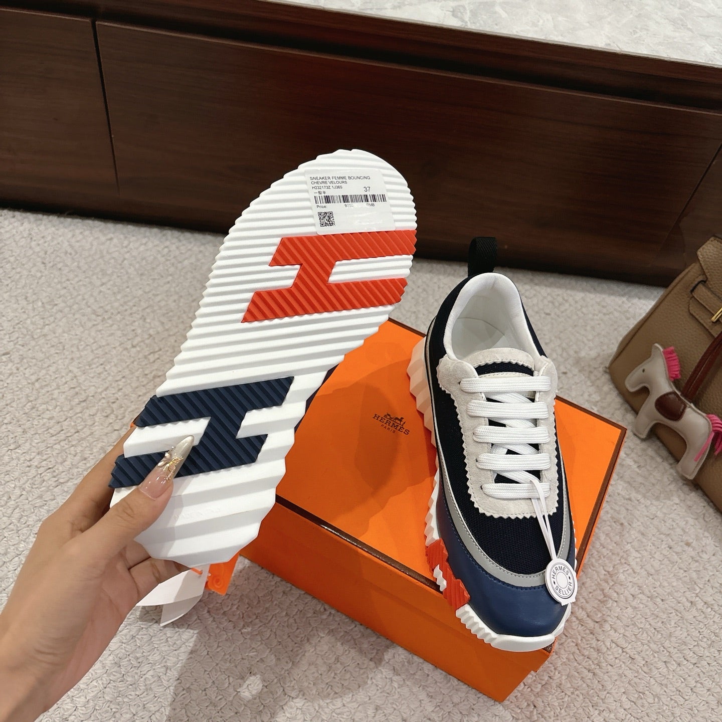 Unisex sneakers with white rubber outsole and navy-and-white upper with white laces