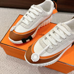 Hermes unisex luxury shoes on box: white laces, brown side stripe, round logo emblem