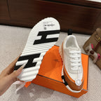 Hermes unisex luxury shoes, outsole view with black and white tread and side profile
