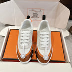 Hermes unisex luxury shoes in white with brown stripe, white laces, round logo badge