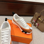 White Hermes unisex sneakers with brown stripe, white laces, rubber sole with tread
