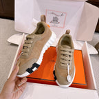 Beige and cream lace-up sneakers with white ribbed sole, side view