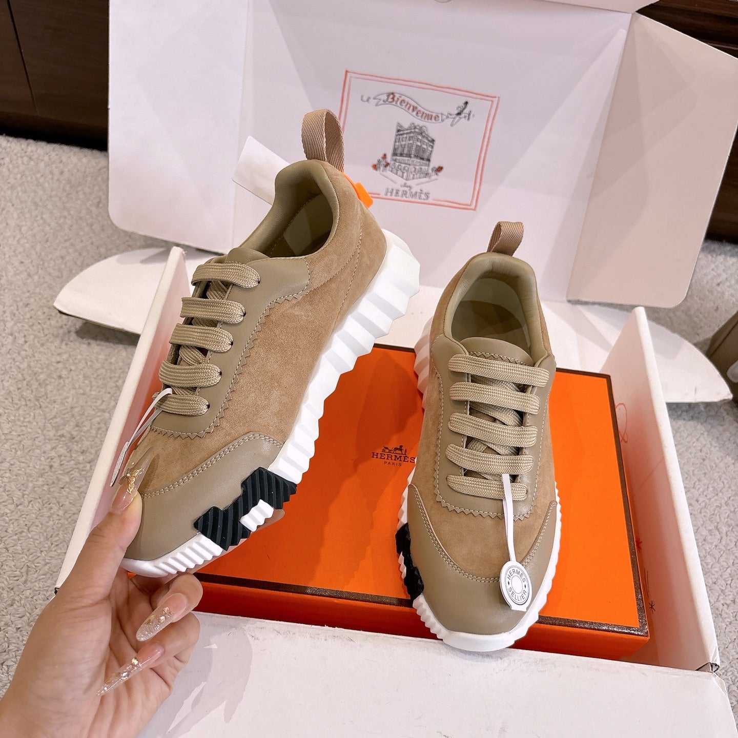 Beige and cream lace-up sneakers with white ribbed sole, side view