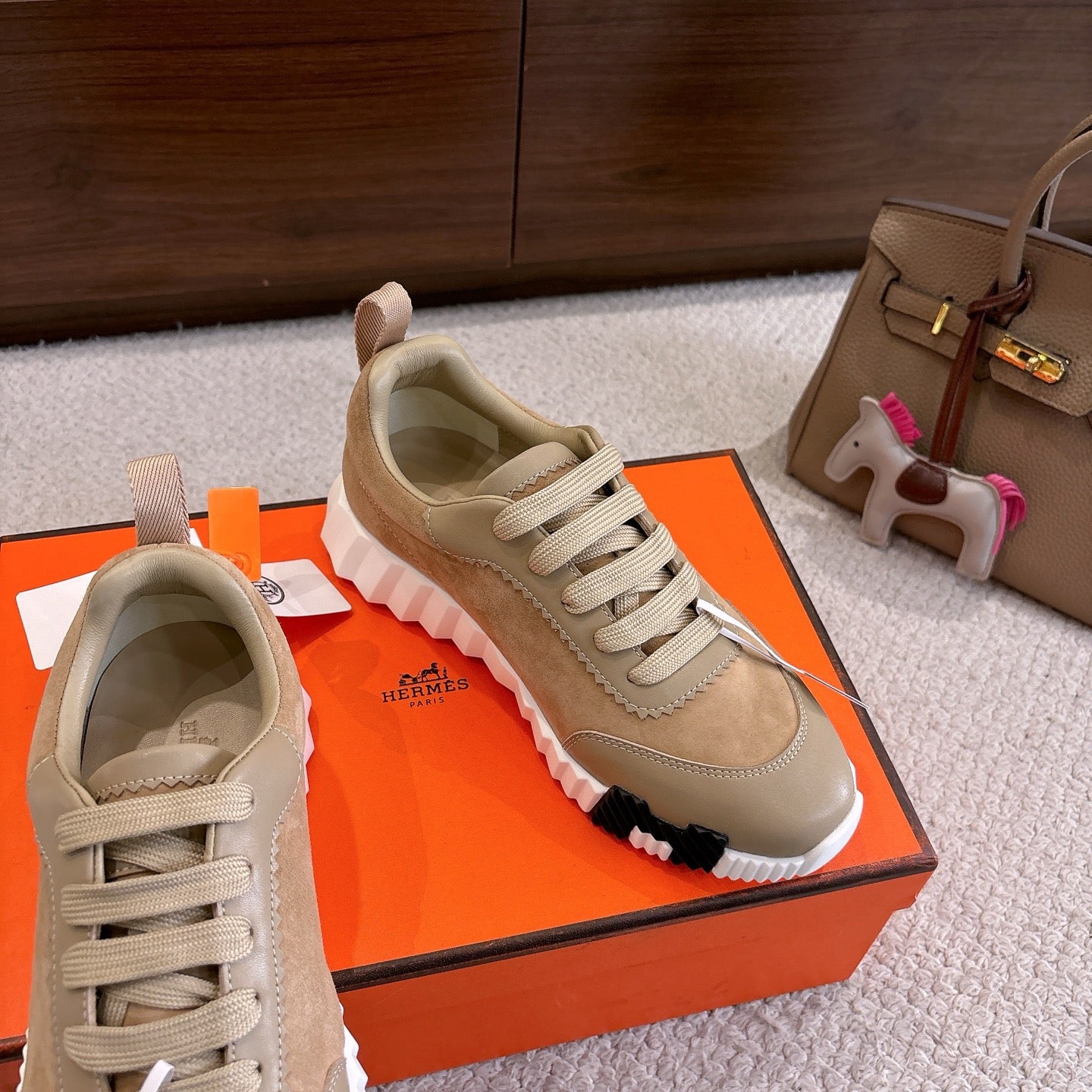 Beige suede lace-up sneakers with white sole and stitched panel detailing
