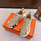 Beige lace-up sneakers with white chunky sole and contrast heel tab, on box