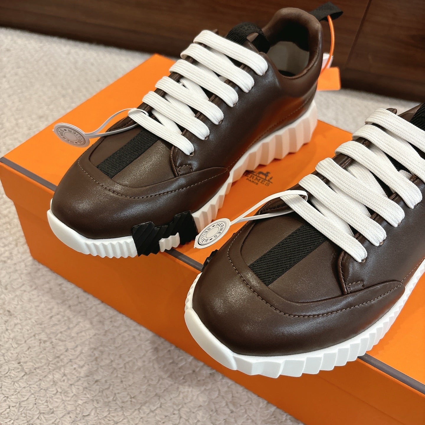 Hermes unisex luxury shoes, dark brown leather, white laces, chunky sole detail