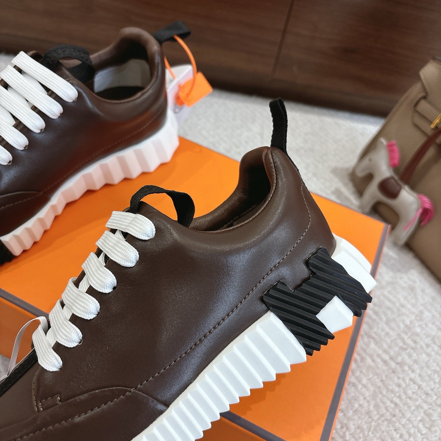 Hermes unisex luxury shoes, dark brown leather, white laces, side panel and sole