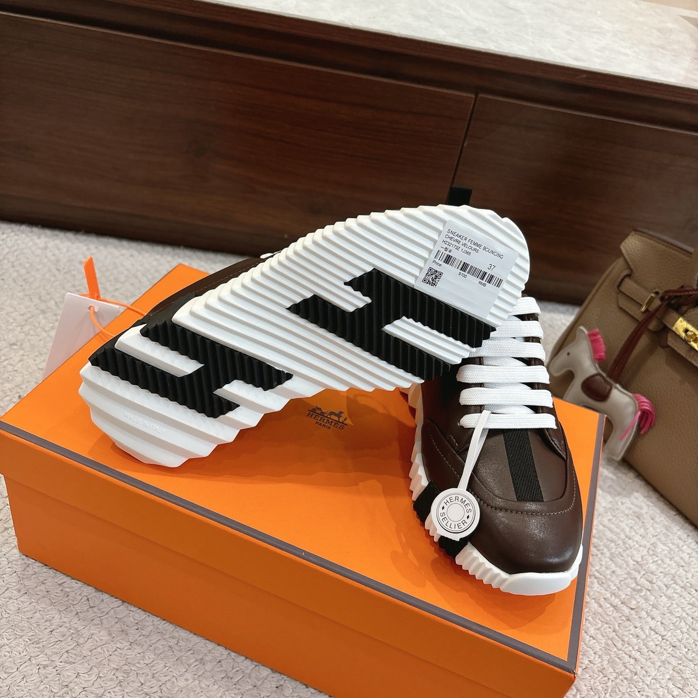 Hermes unisex luxury shoes, dark brown leather, white laces, rubber sole with tread