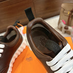 Hermes unisex luxury shoes, dark brown leather, white laces, interior logo insole
