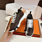 Hermes unisex luxury shoes, dark brown leather, white laces, side view on box