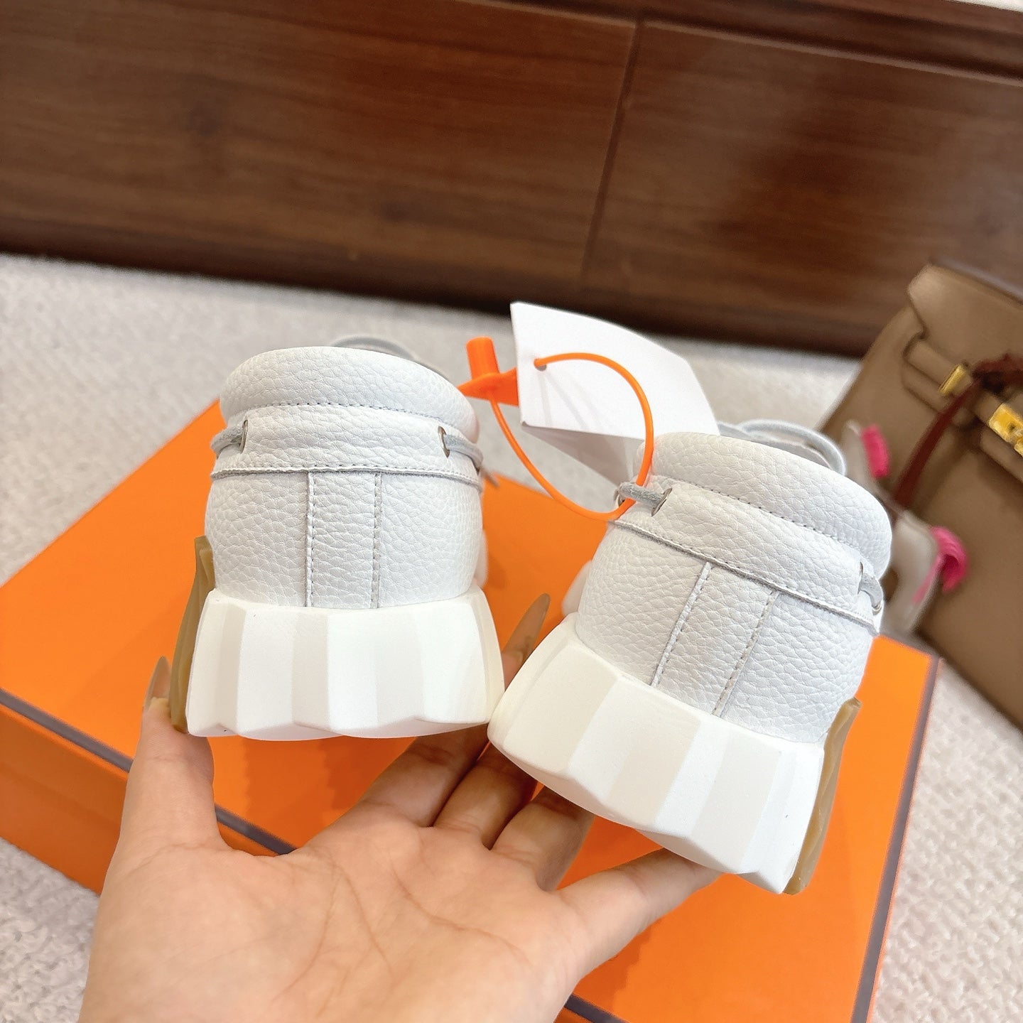 White leather sneakers heel view with thick cushioned sole