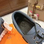 Blue leather sneaker upper with lace-up eyelets and cushioned interior lining