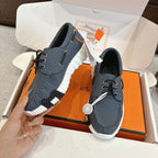 Blue leather lace-up sneakers with white side stripe detail and chunky tread sole