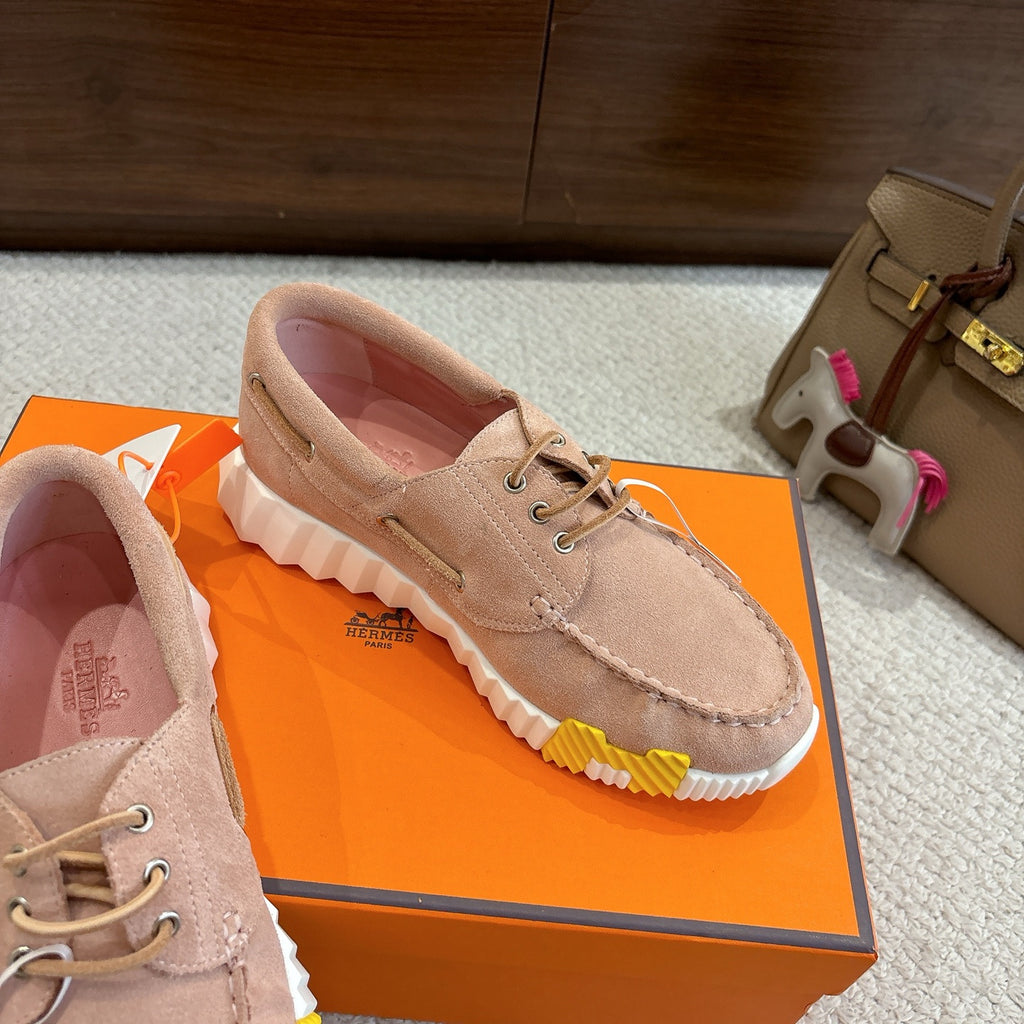 Beige suede lace-up shoes with chunky ridged sole and multicolor side detail