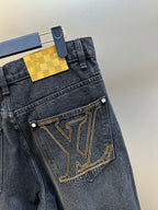 Dark blue denim pants with LV V-pocket logo and gold-tone stitched trim