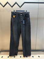 Dark blue denim pants with front button-and-zip closure and belt loops