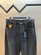 Dark blue denim pants with two front pockets and waistband button closure