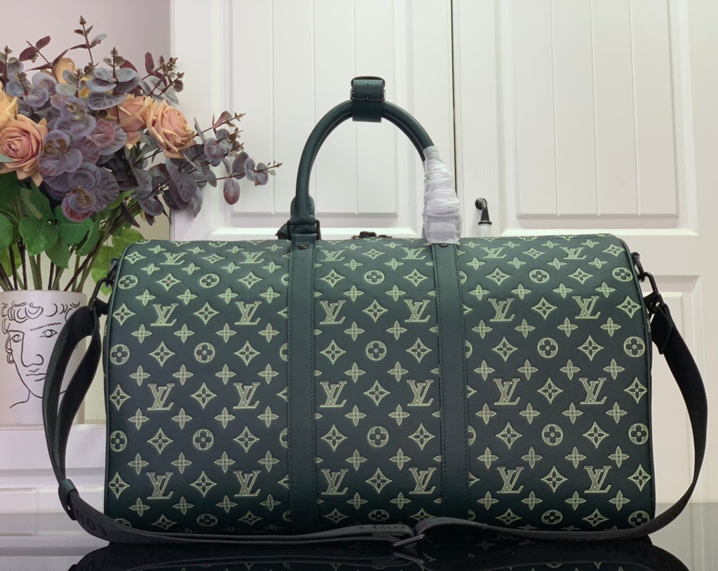 Louis Vuitton green monogram duffel bag front view with top handles and straps