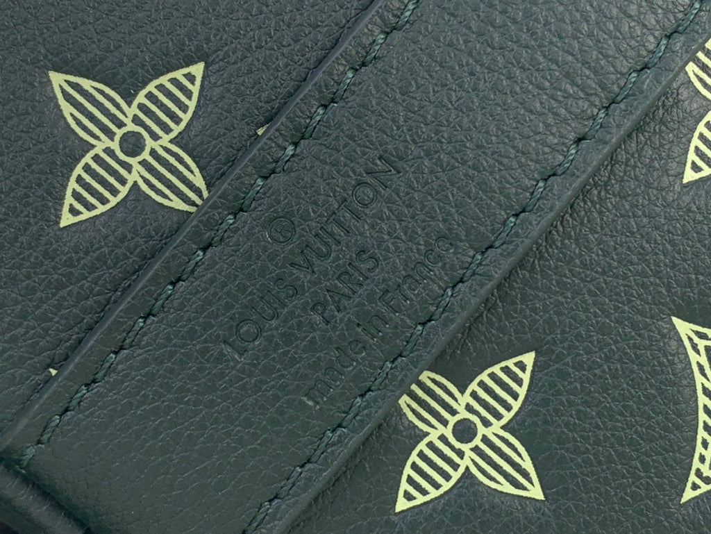 Louis Vuitton green leather panel with stitched logo and decorative monogram pattern