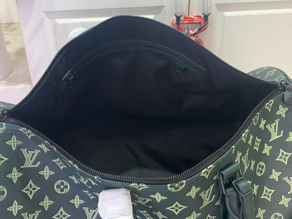 Louis Vuitton green monogram duffel bag interior view with open top zipper